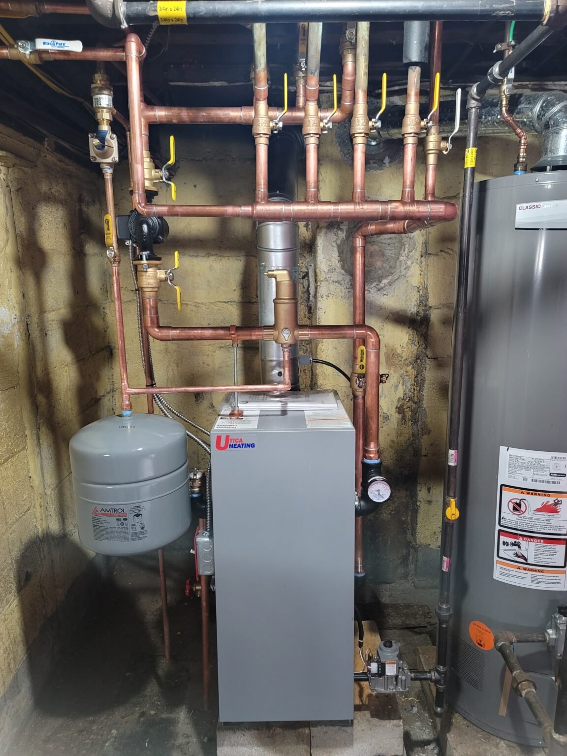 Heating system repair: hot water boiler with copper piping and expansion tank installed by Absolute Precision in Bergen County, NJ