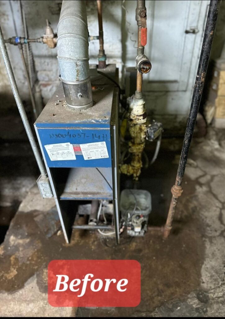 Before: old leaking boiler with rusted, corroded pipes in a Bergen County basement