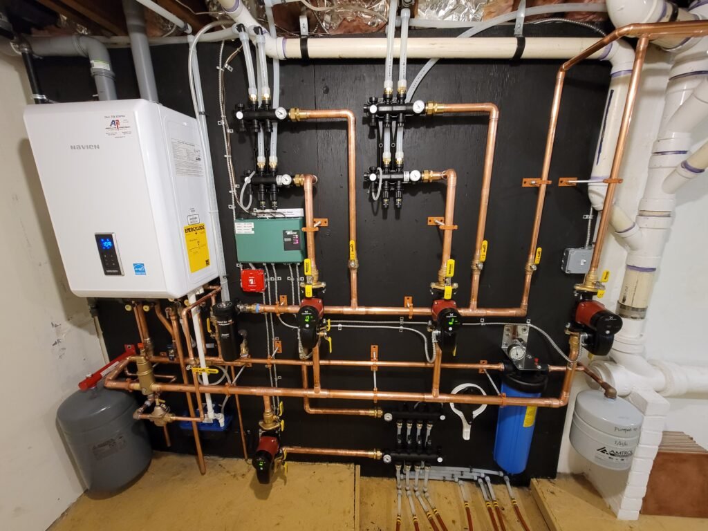 Navien NCB combi boiler installed with a radiant heating manifold by Absolute Precision