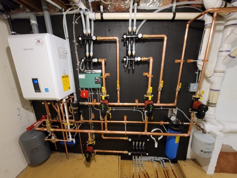 Navien NCB combi boiler installed with a radiant heating manifold by Absolute Precision, serving Upper Saddle River, NJ