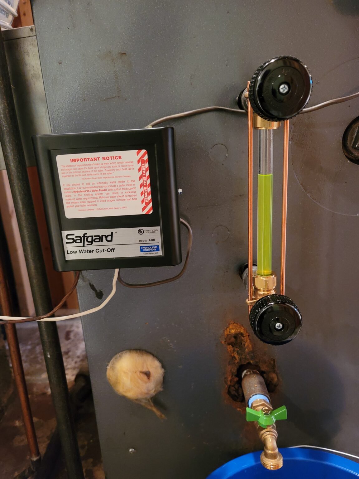 Steam heating repairs: low water cut-off and gauge glass on a steam boiler