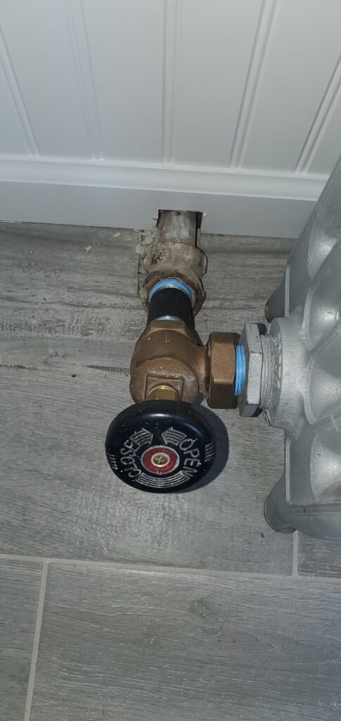 Steam radiator valve on a cast iron radiator in a Bergen County home