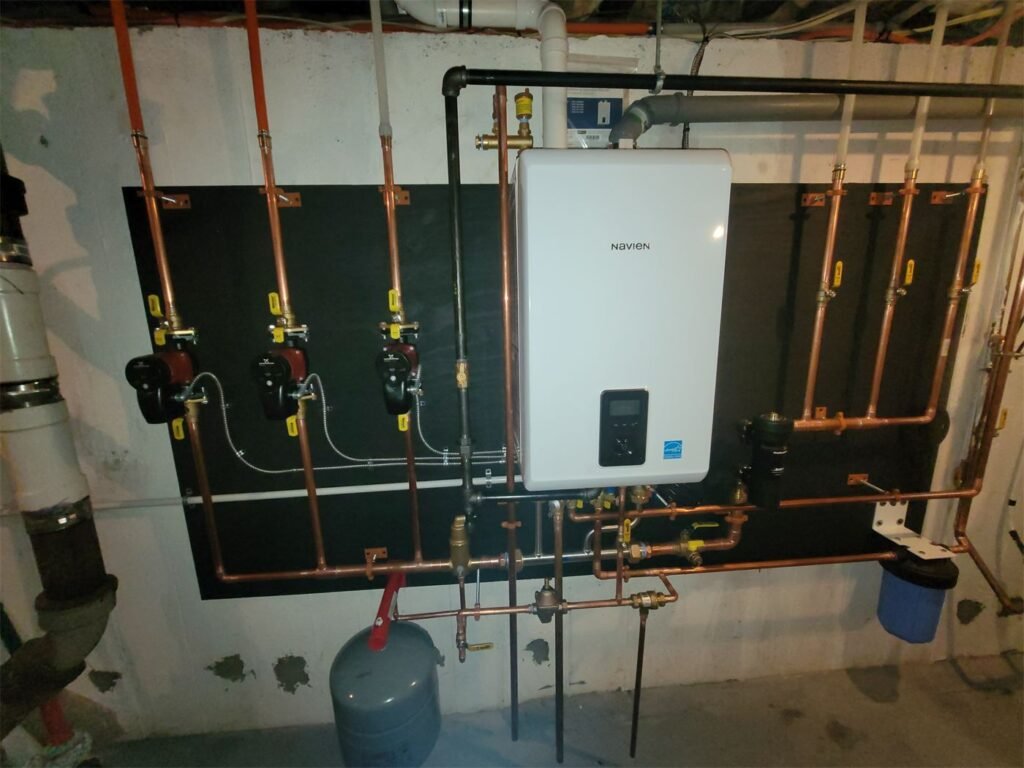 Navien combi boiler with circulator pumps installed by Absolute Precision Plumbing and Heating in Waldwick, NJ
