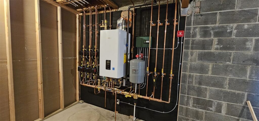 Navien combi boiler with multi-zone piping installed by Absolute Precision Plumbing and Heating in Wyckoff, NJ