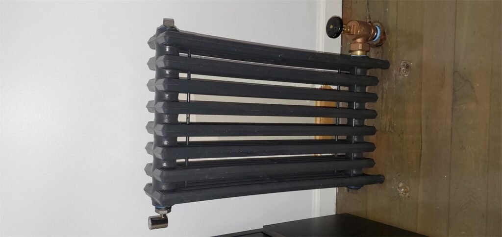 Steam radiator installed with new valve by Absolute Precision Plumbing and Heating in River Edge, NJ