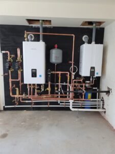 Navien NPE tankless water heater and NFC combi boiler installed by Absolute Precision Plumbing and Heating in Alpine, NJ