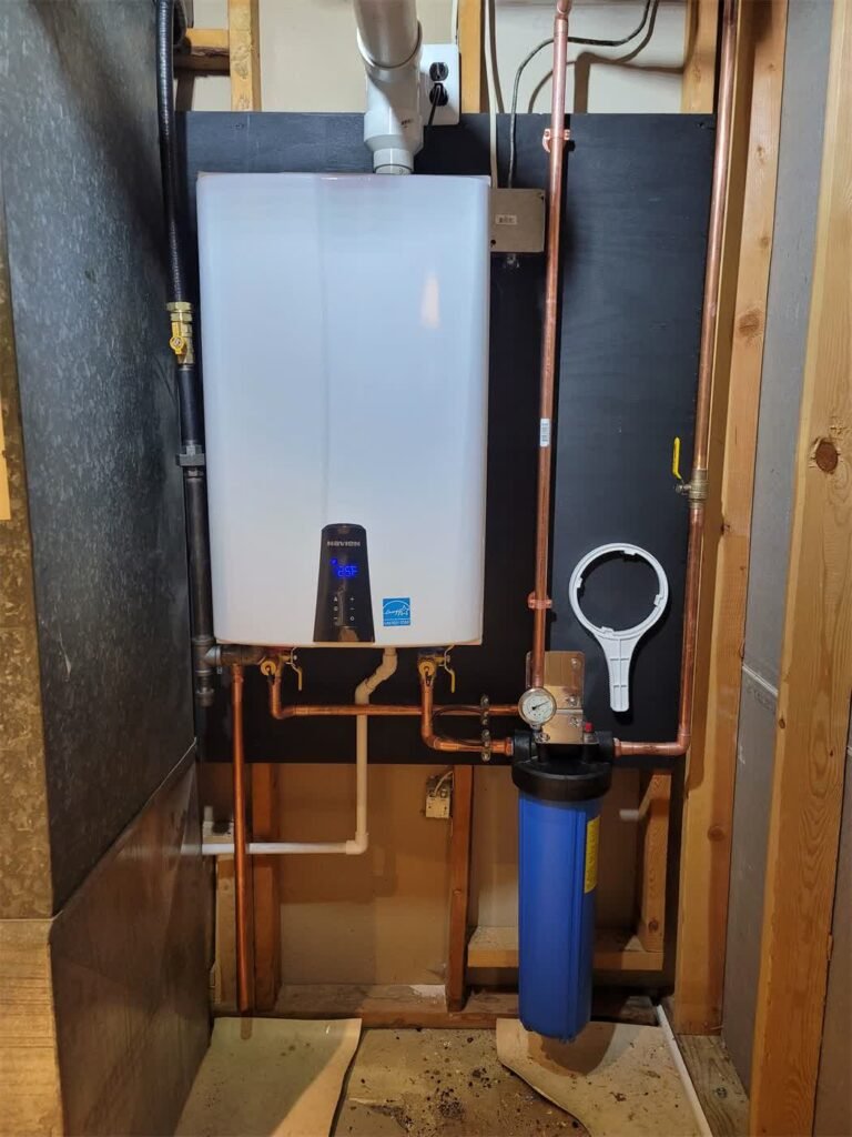 Navien tankless water heater installed in an attic by Absolute Precision Plumbing and Heating in Saddle Brook, NJ